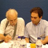 14 Pavlos Moutecidis (left) and Harry Fougiaxis (right) studying the entries of the H#2 Quick Composing Ty